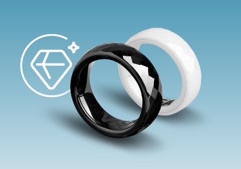 Two rings: one white and one black with a shiny surface. The VISA logo is visible inside the white ring.