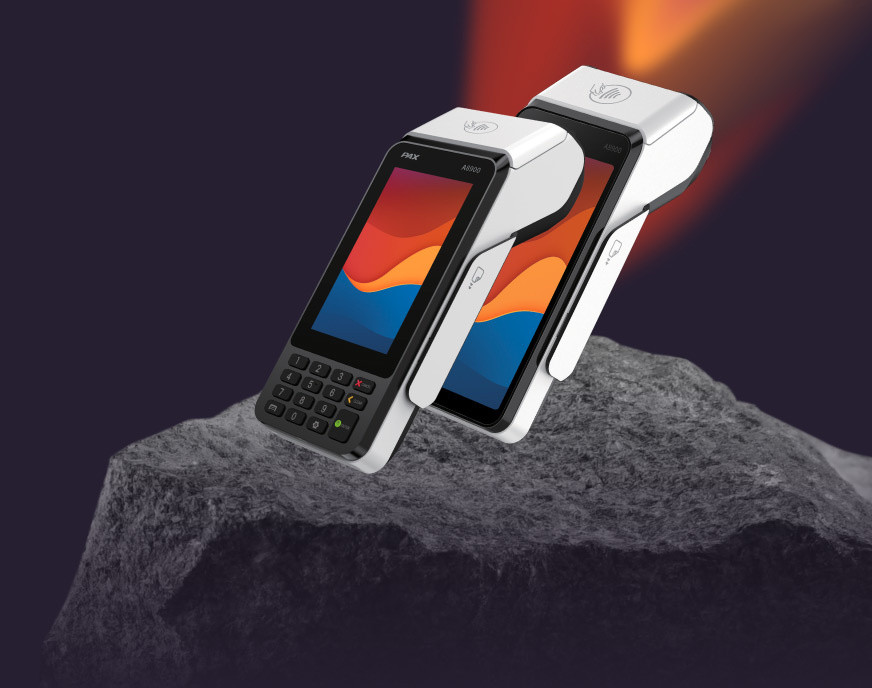Two PAX POS terminals – one with a numeric keypad, the other without, both with a color display and a contactless payment icon.